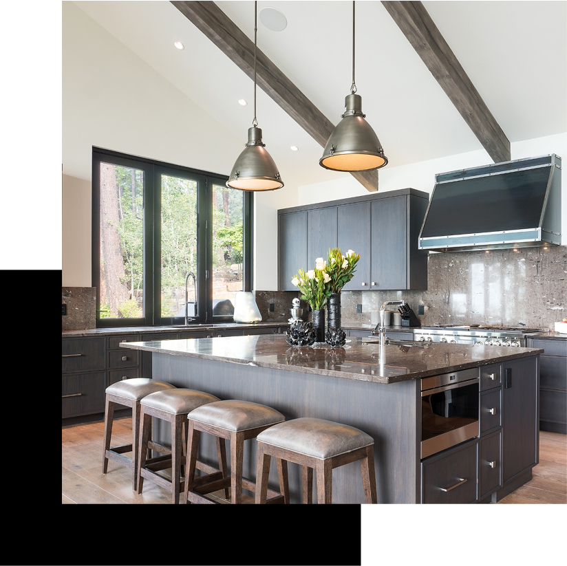 Modern kitchen with green cabinets and island.