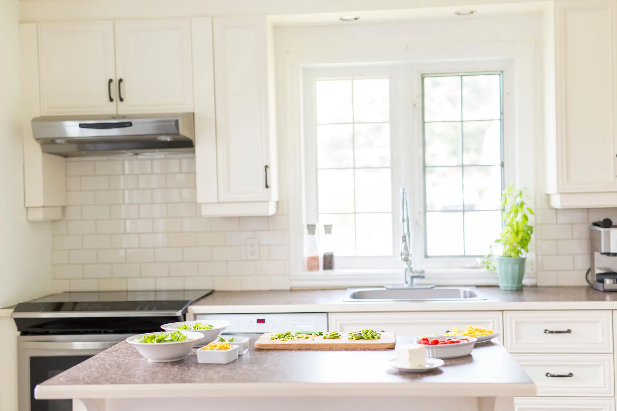 Bright kitchen with food on the counter.